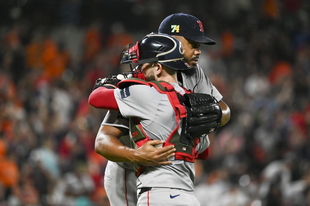 Aug 16, 2024; Baltimore, Maryland, USA;  Boston Red Sox catcher Connor Wong (12) celebrates with  relief pitcher Kenley Jansen (74) after the game against the Baltimore Orioles at Oriole Park at Camden Yards. Mandatory Credit: Tommy Gilligan-USA TODAY Sports