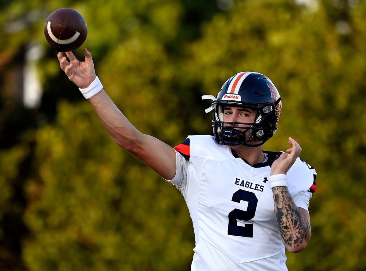 Nashville Christian quarterback Jared Curtis (2) passes as he warms up before an high school football scrimmage against Franklin Road Academy Friday, Aug. 16, 2024, in Nashville, Tenn.