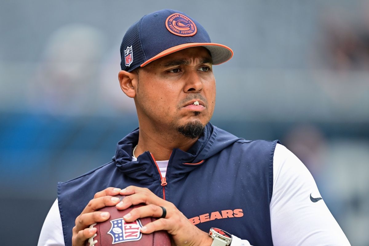 Aug 17, 2024; Chicago, Illinois, USA; Chicago Bears general manager Ryan Poles plays catch on the sideline before the game against the Cincinnati Bengals at Soldier Field. Mandatory Credit: Daniel Bartel-Imagn Images