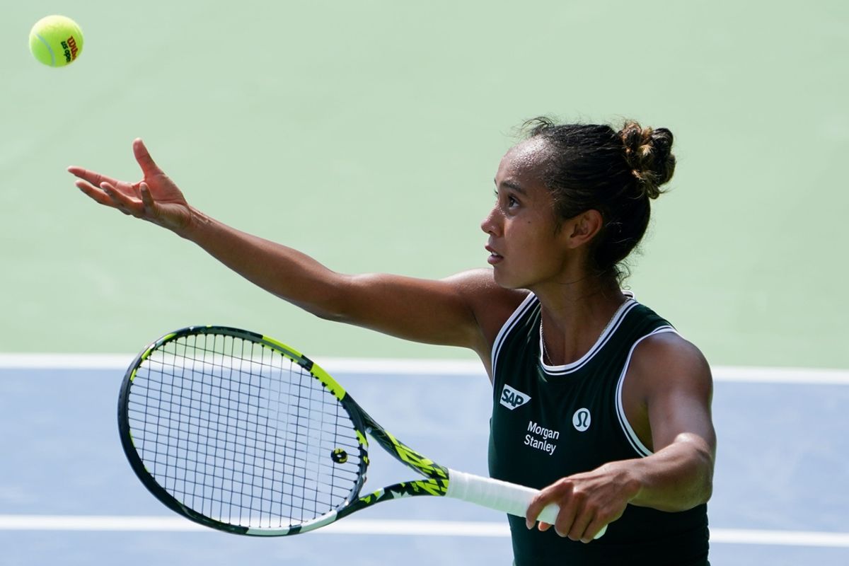 Leylah Fernandez makes prepares a serve to Jessica Pegula in the women’s singles quarterfinals during the Cincinnati Open, Saturday, Aug. 17, 2024, at the Lindner Family Tennis Center in Mason.