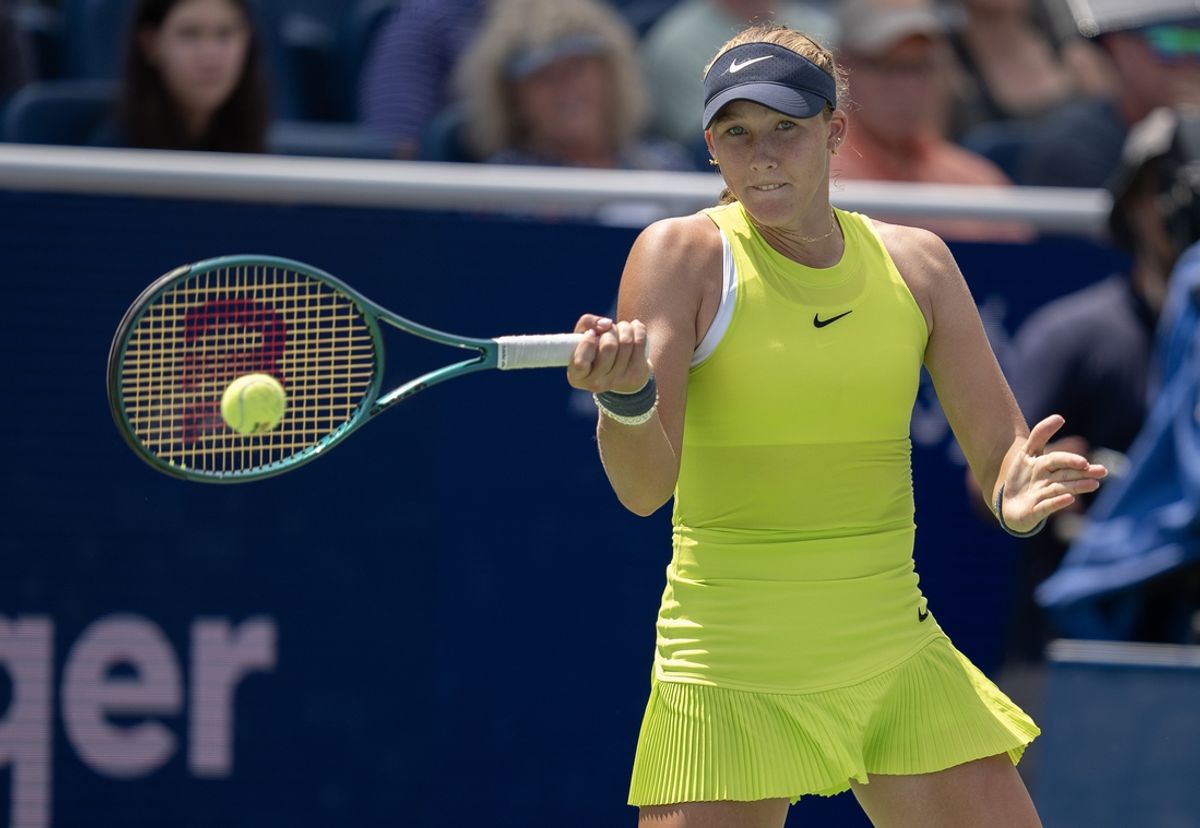 Aug 17, 2024; Cincinnati, OH, USA;  Mirra Andreeva returns a shot during her match against Iga Swiatek of Poland on day six of the Cincinnati Open. Mandatory Credit: Susan Mullane-Imagn Images