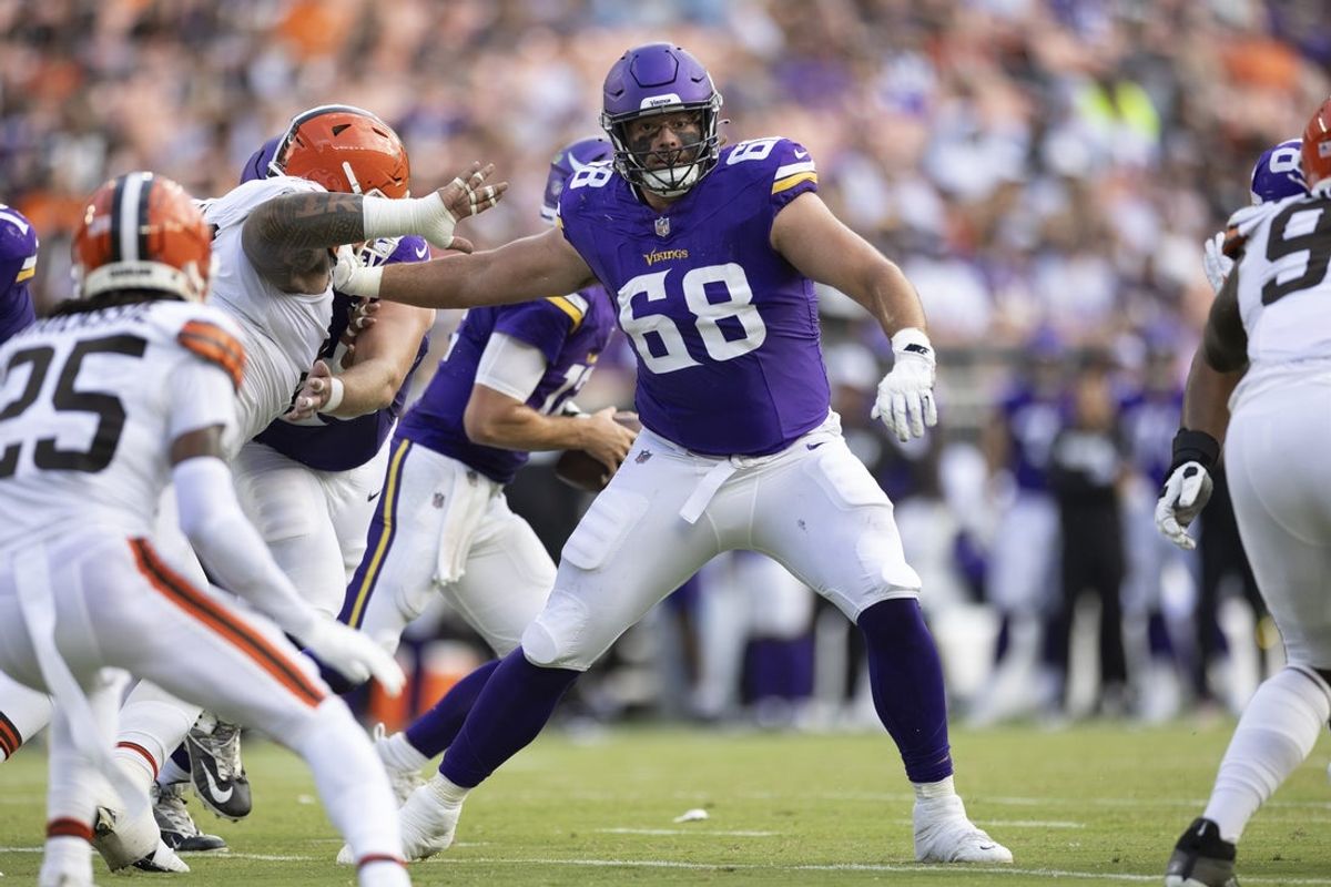 Aug 17, 2024; Cleveland, Ohio, USA; Minnesota Vikings guard Henry Byrd (68) blocks against the Cleveland Browns defense during the second quarter at Cleveland Browns Stadium. Mandatory Credit: Scott Galvin-Imagn Images