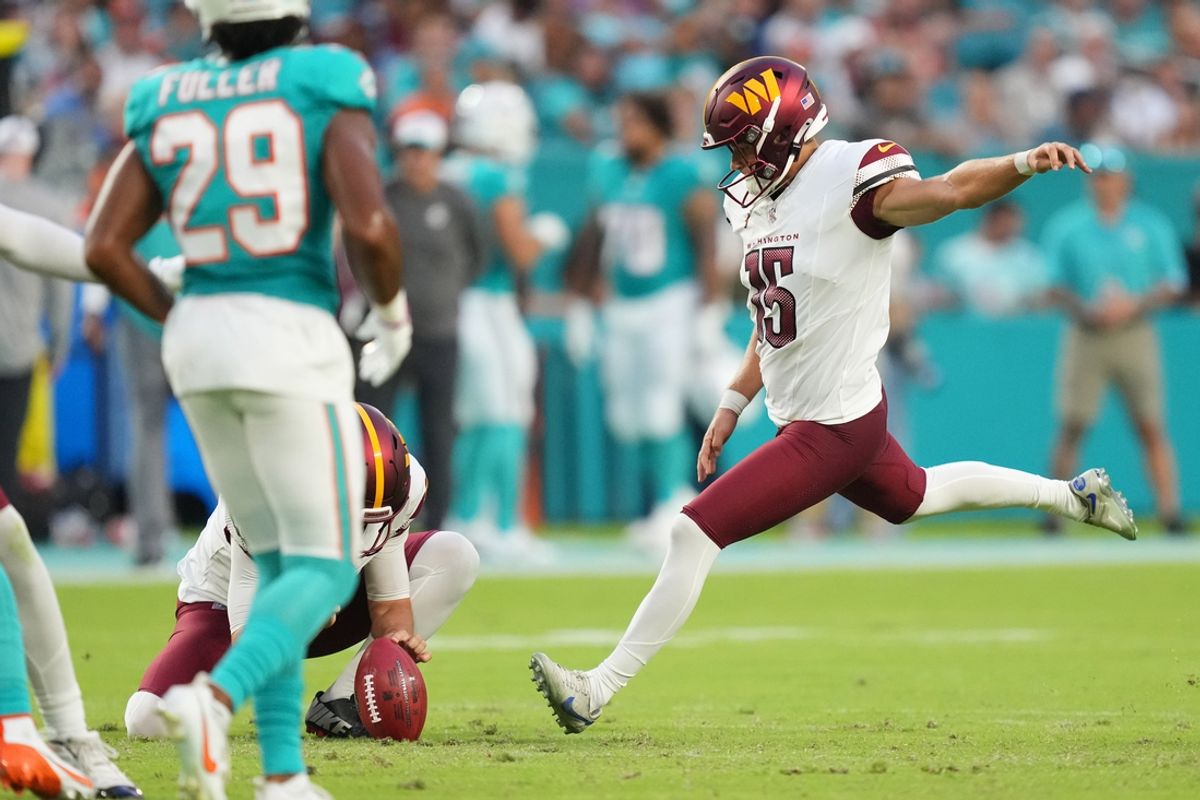 Aug 17, 2024; Miami Gardens, Florida, USA;  Washington Commanders kicker Riley Patterson (15) attempts a field goal against the Miami Dolphins during the first quarter at Hard Rock Stadium. Mandatory Credit: Jim Rassol-Imagn Images