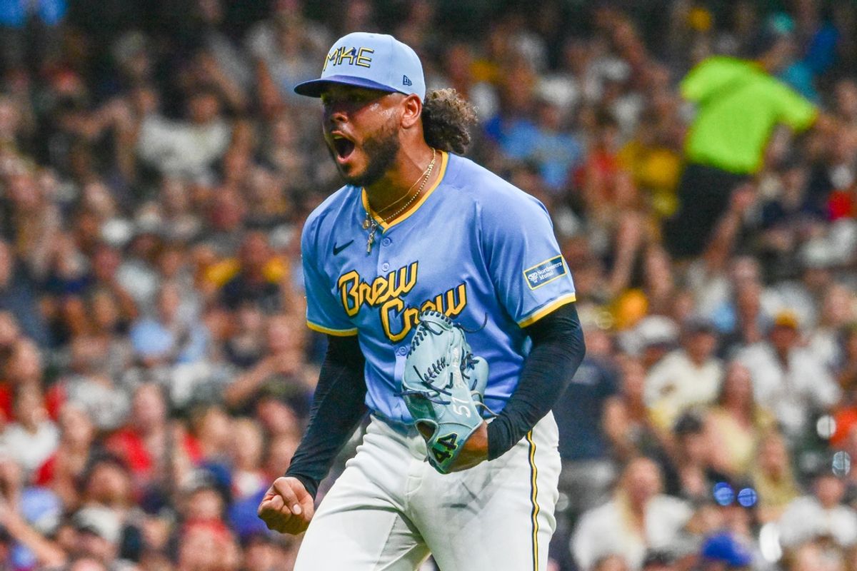 Aug 17, 2024; Milwaukee, Wisconsin, USA; Milwaukee Brewers starting pitcher Freddy Peralta (51) reacts after striking out Cleveland Guardians first baseman Josh Naylor (22) in the sixth inning at American Family Field. Mandatory Credit: Benny Sieu-USA TODAY Sports