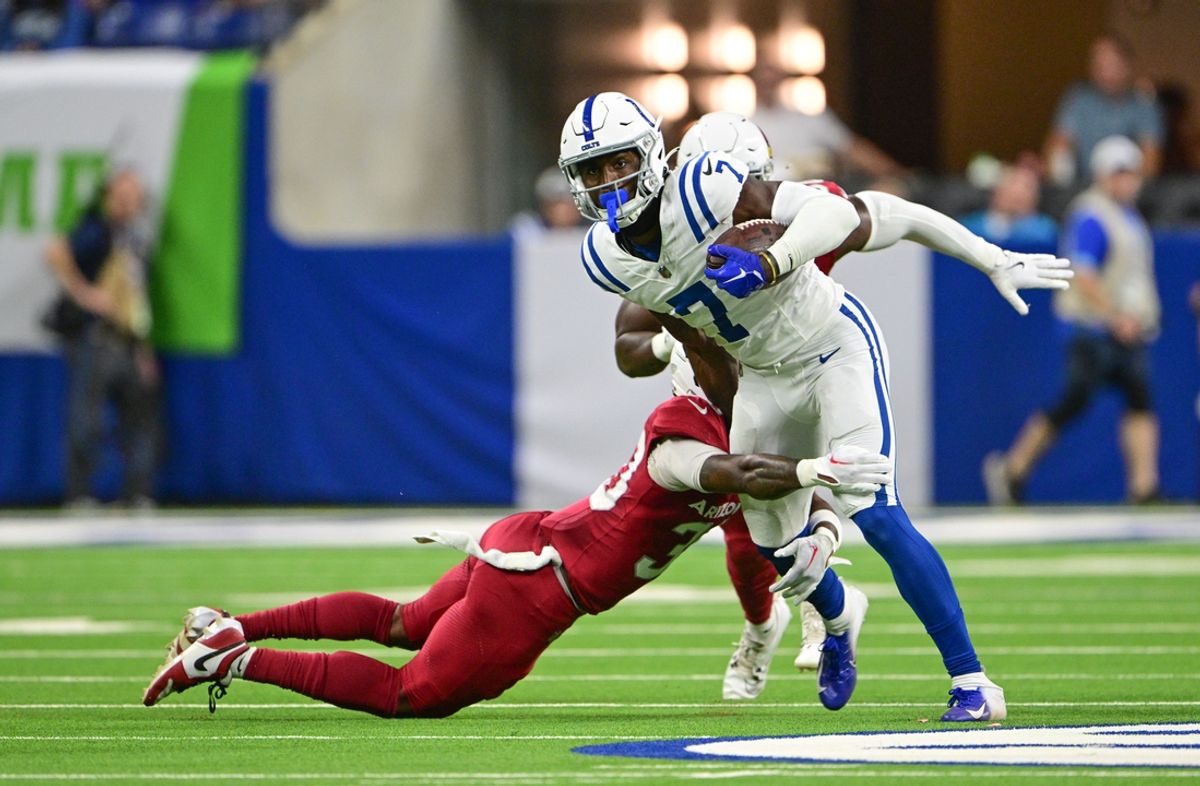 Aug 17, 2024; Indianapolis, Indiana, USA; Indianapolis Colts wide receiver Laquon Treadwell (7) is tackled by Arizona Cardinals cornerback Darren Hall (30) during the second half at Lucas Oil Stadium. Mandatory Credit: Marc Lebryk-Imagn Images