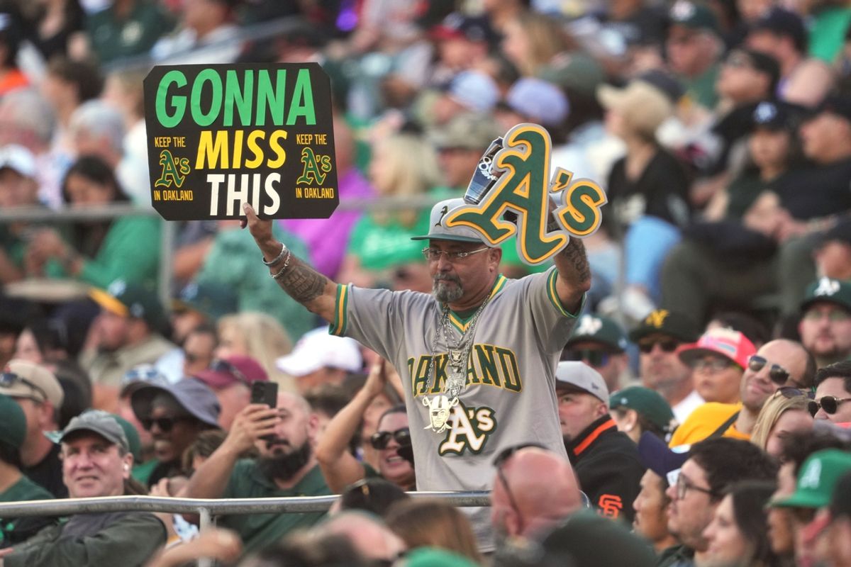 Aug 17, 2024; Oakland, California, USA; A fan of the Oakland Athletics holds up a sign during the eighth inning against the San Francisco Giants at Oakland-Alameda County Coliseum. Mandatory Credit: Darren Yamashita-USA TODAY Sports