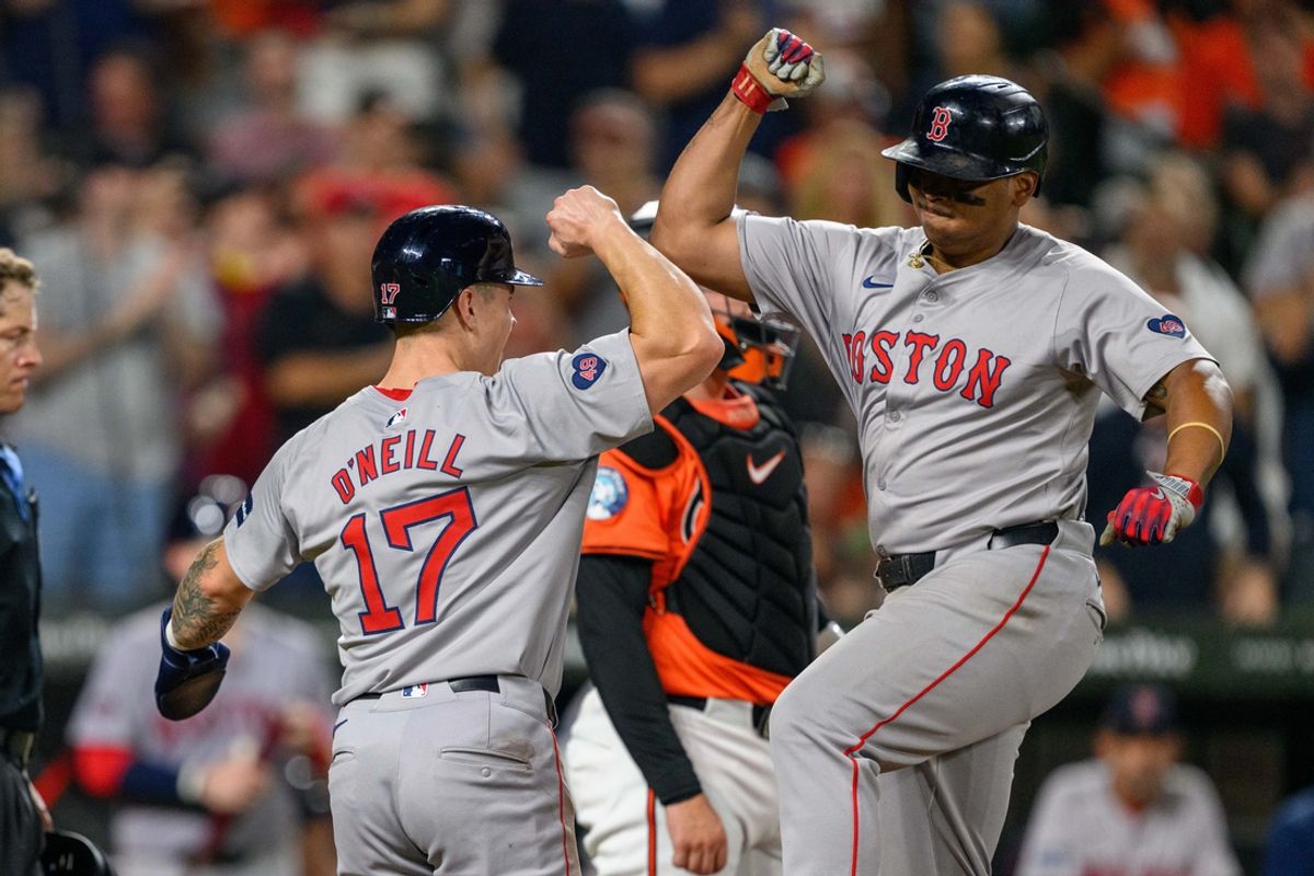 Aug 17, 2024; Baltimore, Maryland, USA; Boston Red Sox third baseman Rafael Devers (11) celebrates with outfielder Tyler O'Neill (17) after hitting a home run during the eighth inning against the Baltimore Orioles at Oriole Park at Camden Yards. Mandatory Credit: Reggie Hildred-USA TODAY Sports