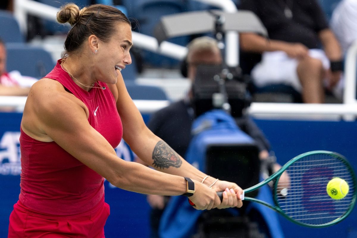 Aryna Sabalenka, of Belarus, returns to Iga Swiatek, of Poland, during the Cincinnati Open at the Lindner Family Tennis Center in Mason on Sunday, Aug. 18, 2024.