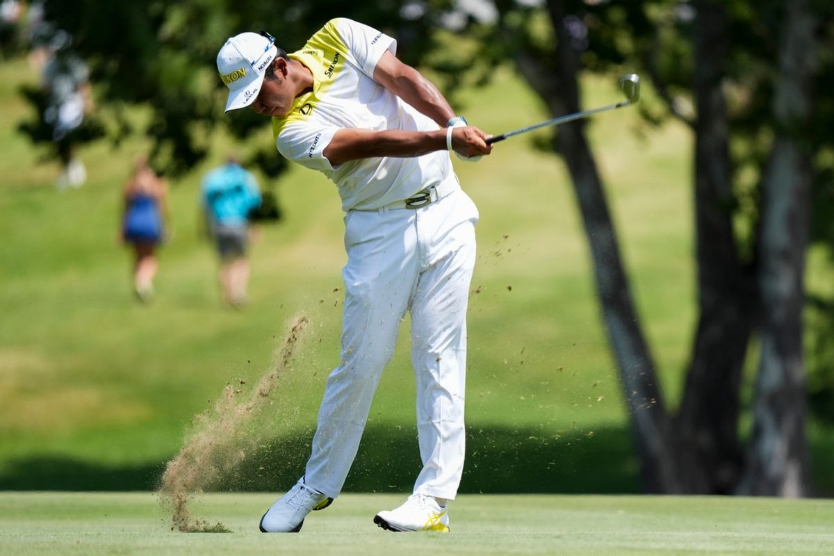 Hideki Matsuyama hits an approach shot on the first hole during the final round of the FedEx St. Jude Championship at TPC Southwind in Memphis, Tenn., on Sunday, August 18, 2024.