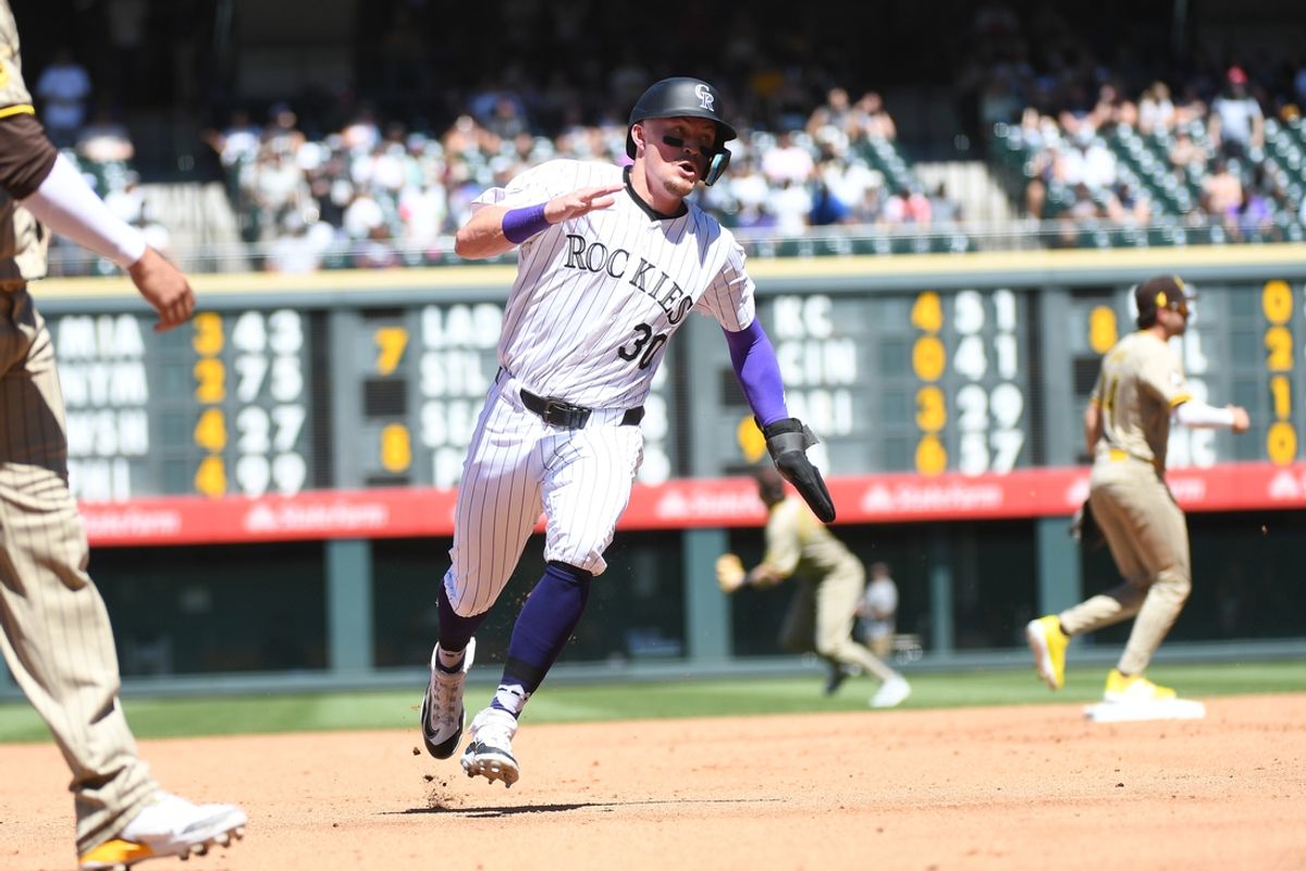 Aug 18, 2024; Denver, Colorado, USA; Colorado Rockies third baseman Aaron Schunk (30) advances to third on a sacrifice fly out in the third inning against the San Diego Padres at Coors Field. Mandatory Credit: Christopher Hanewinckel-USA TODAY Sports