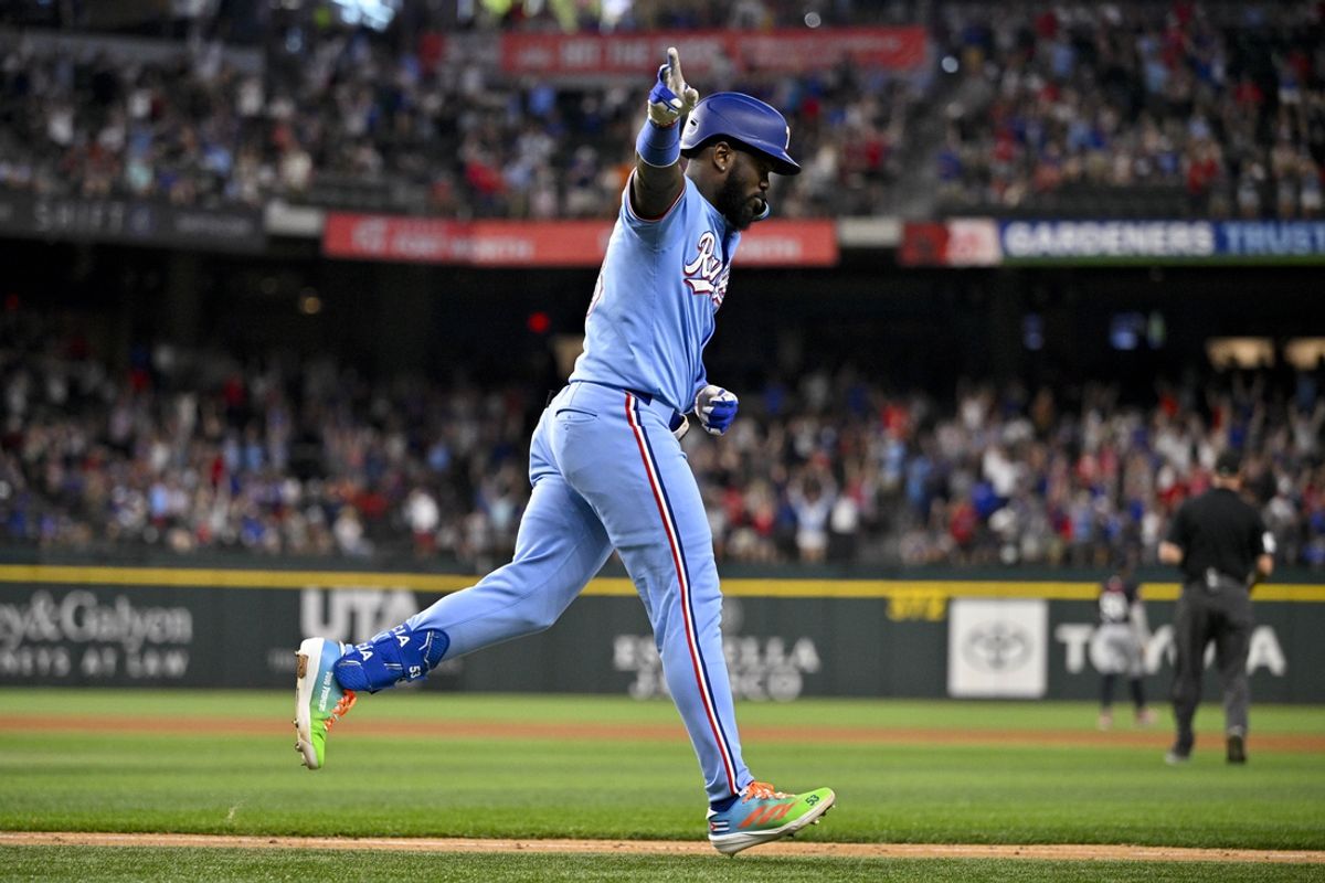 Aug 18, 2024; Arlington, Texas, USA; Texas Rangers right fielder Adolis Garcia (53) rounds the bases after he hits a two run home run against the Minnesota Twins during the seventh inning at Globe Life Field. Mandatory Credit: Jerome Miron-USA TODAY Sports