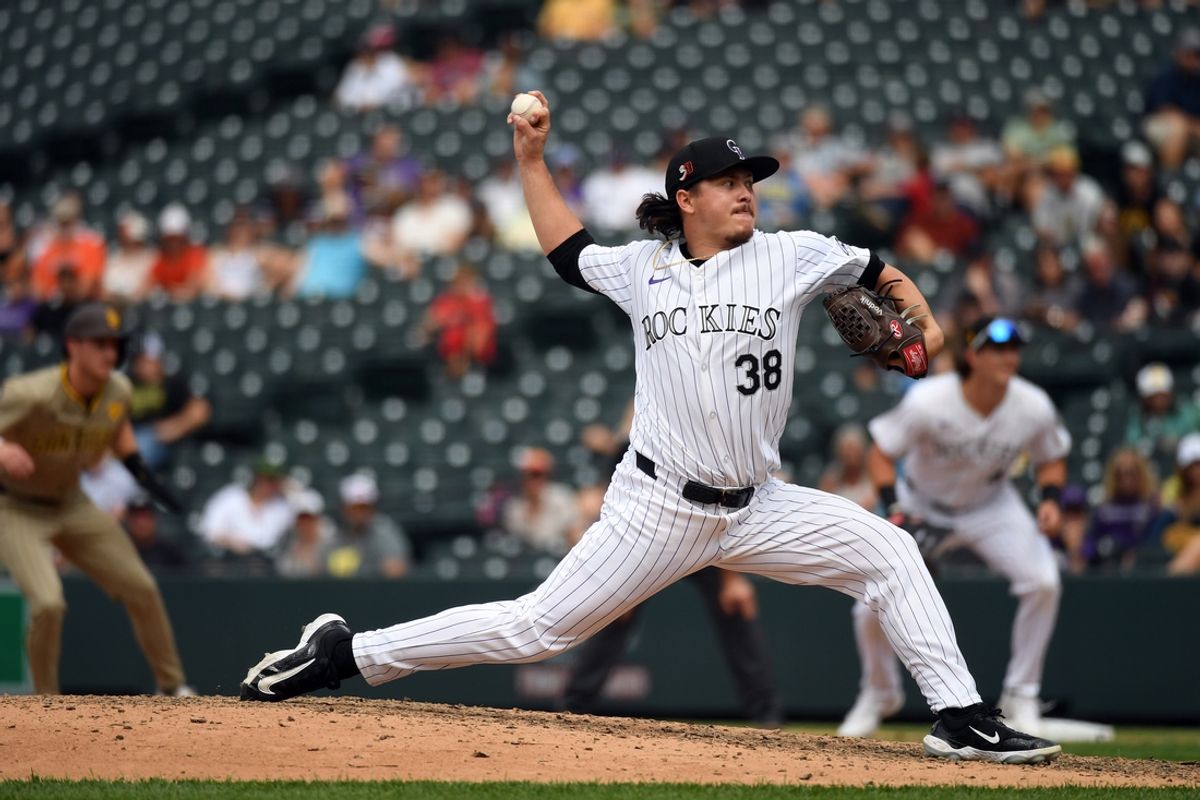 Aug 18, 2024; Denver, Colorado, USA; Colorado Rockies pitcher Victor Vodnik (38) throws in the ninth inning against the San Diego Padres at Coors Field. Mandatory Credit: Christopher Hanewinckel-USA TODAY Sports
