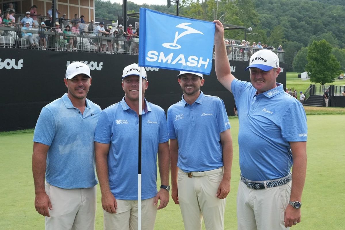 Aug 18, 2024; Greenbrier, West Virginia, USA; Smash GC team members Brooks Koepka and Tylor Gooch and John Catlin and Jason Kokrak on the 18th green at The Old White at the Greenbrier. Mandatory Credit: Bob Donnan-Imagn Images