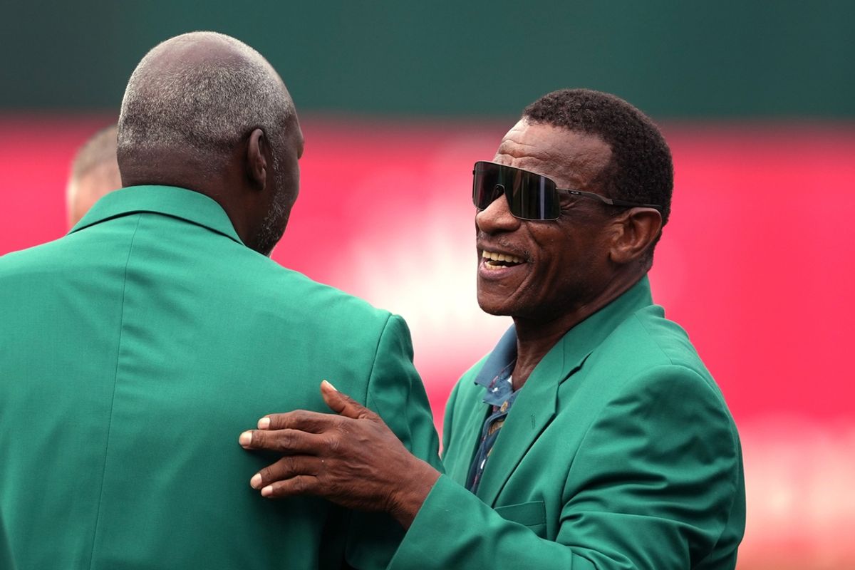 Aug 17, 2024; Oakland, California, USA; Oakland Athletics former outfielder Rickey Henderson (right) talks with former pitcher Dave Stewart (left) before the game against the San Francisco Giants at Oakland-Alameda County Coliseum. Mandatory Credit: Darren Yamashita-Imagn Images