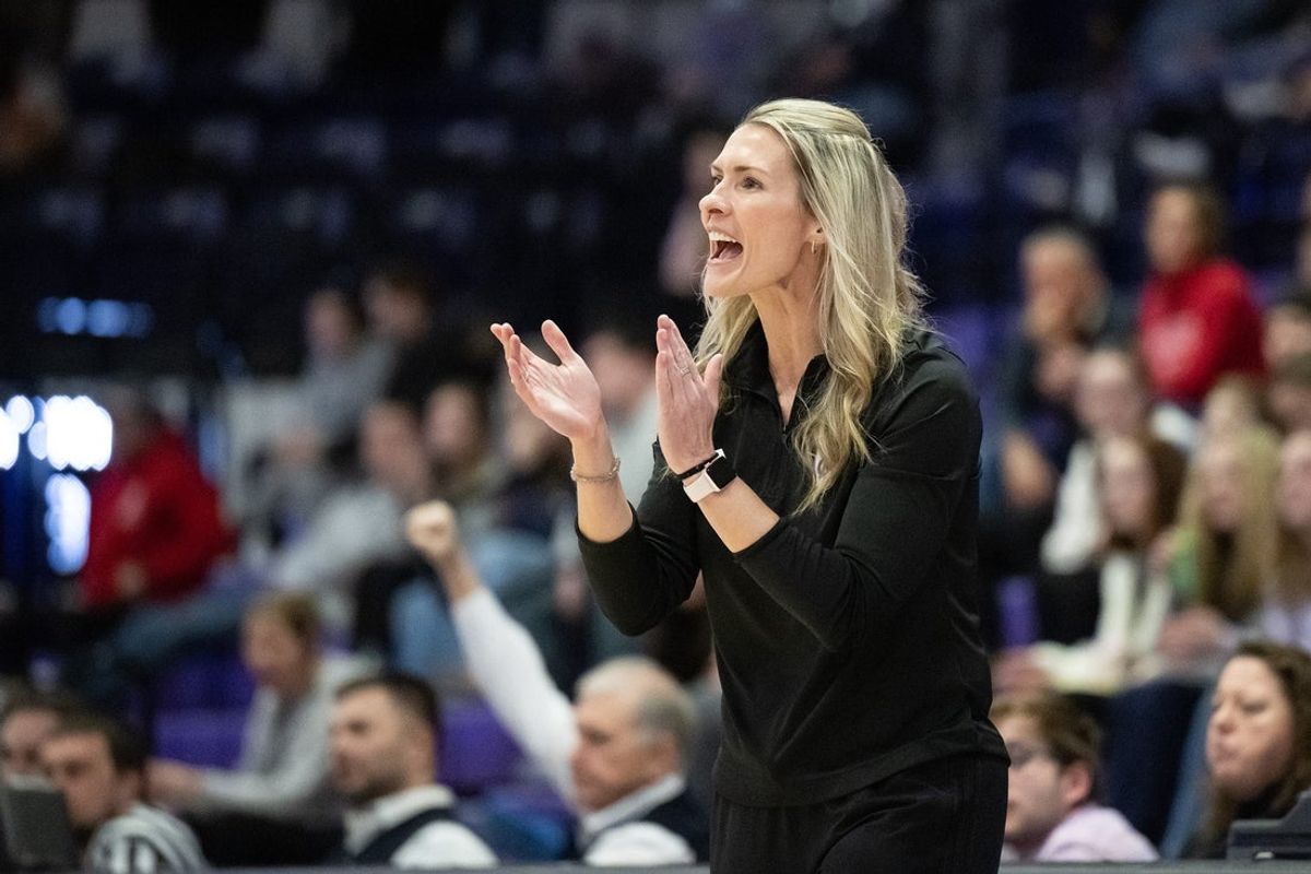 Holy Cross coach Maureen Magarity cheers on her squad as the Crusaders take on American in the Patriot League Tournament.