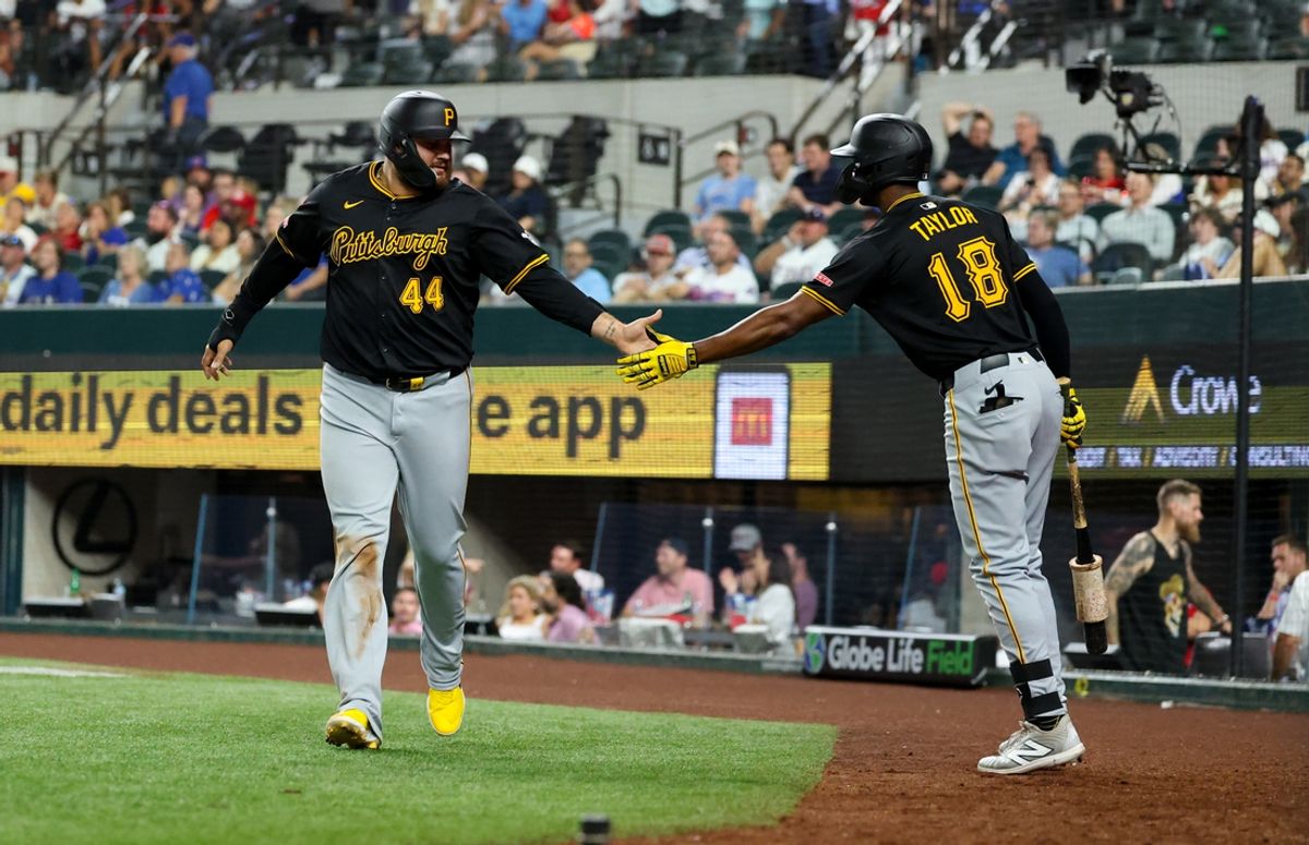 Aug 20, 2024; Arlington, Texas, USA; Pittsburgh Pirates first baseman Rowdy Tellez (44) celebrates with Pittsburgh Pirates center fielder Michael A. Taylor (18) after scoring during the ninth inning against the Texas Rangers  at Globe Life Field. Mandatory Credit: Kevin Jairaj-Imagn Images