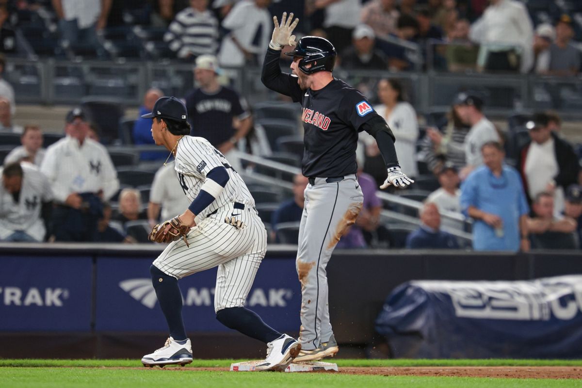 Aug 20, 2024; Bronx, New York, USA; Cleveland Guardians pinch hitter David Fry (6) reacts after hitting a three run triple during the twelfth inning against the New York Yankees at Yankee Stadium. Mandatory Credit: Vincent Carchietta-USA TODAY Sports