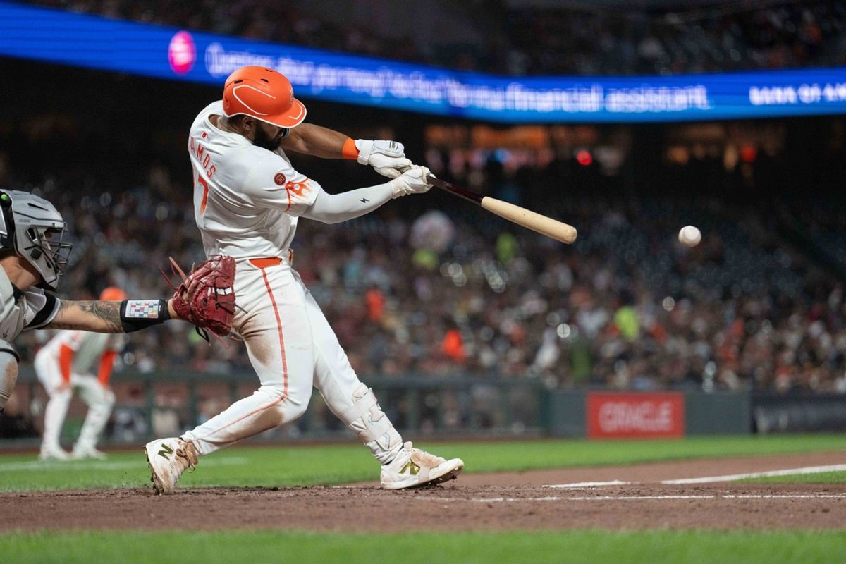 Aug 20, 2024; San Francisco, California, USA;  San Francisco Giants outfielder Heliot Ramos (17) hits an RBI single during the fifth inning against the Chicago White Sox at Oracle Park. Mandatory Credit: Stan Szeto-USA TODAY Sports