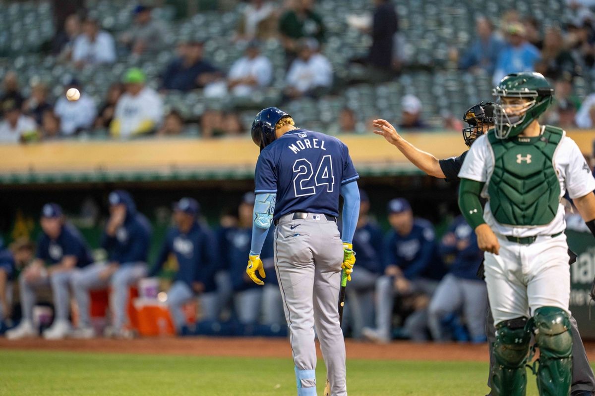Aug 20, 2024; Oakland, California, USA; Tampa Bay Rays second baseman Christopher Morel (24) reacts after a called third strike with a man in scoring position against the Oakland Athletics during the sixth inning at Oakland-Alameda County Coliseum. Mandatory Credit: Neville E. Guard-USA TODAY Sports