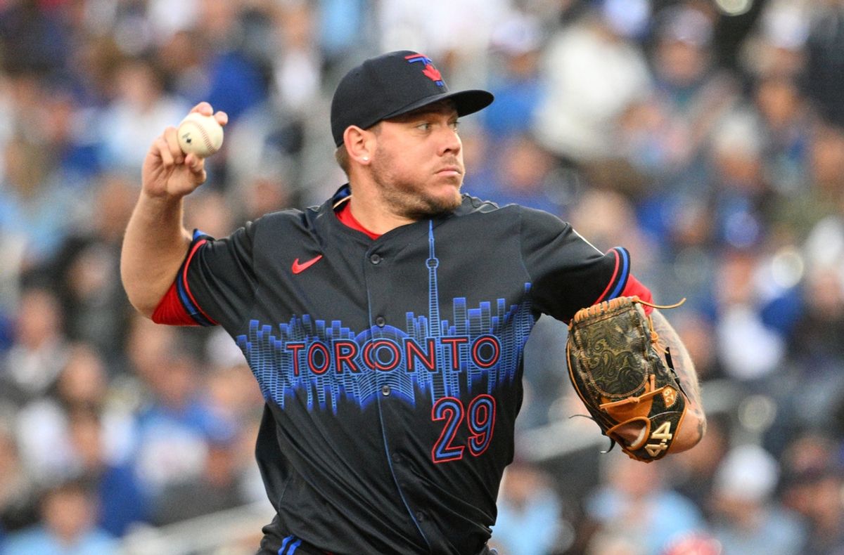 Aug 21, 2024; Toronto, Ontario, CAN;  Toronto Blue Jays starting pitcher Yariel Rodriguez (29) delivers a pitch against the Cincinnati Reds in the first inning at Rogers Centre. Mandatory Credit: Dan Hamilton-Imagn Images