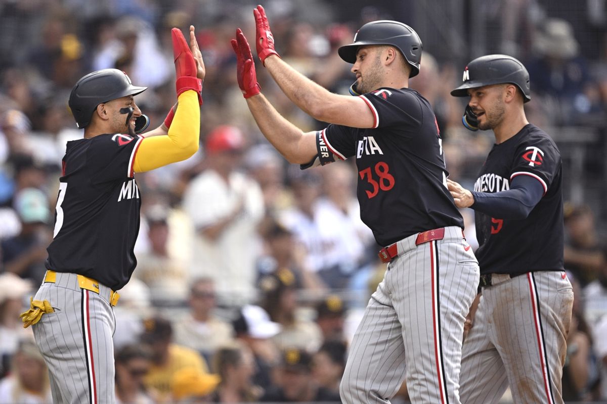 Aug 21, 2024; San Diego, California, USA; Minnesota Twins right fielder Matt Wallner (38) celebrates with left fielder Trevor Larnach (9) and third baseman Royce Lewis (23) after hitting a three-run home run against the San Diego Padres during the fourth inning at Petco Park. Mandatory Credit: Orlando Ramirez-USA TODAY Sports