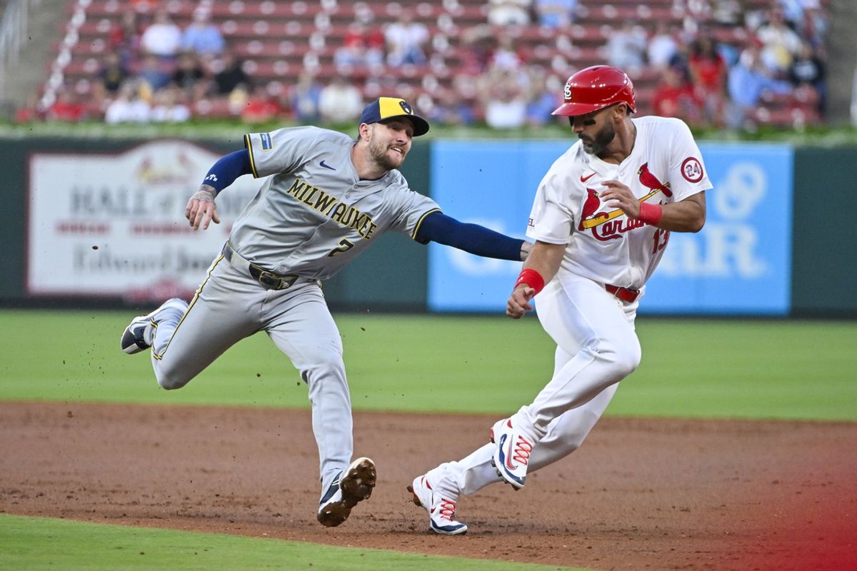 Aug 21, 2024; St. Louis, Missouri, USA;  Milwaukee Brewers second baseman Brice Turang (2) tags out St. Louis Cardinals designated hitter Matt Carpenter (13) to end the second inning at Busch Stadium. Mandatory Credit: Jeff Curry-USA TODAY Sports