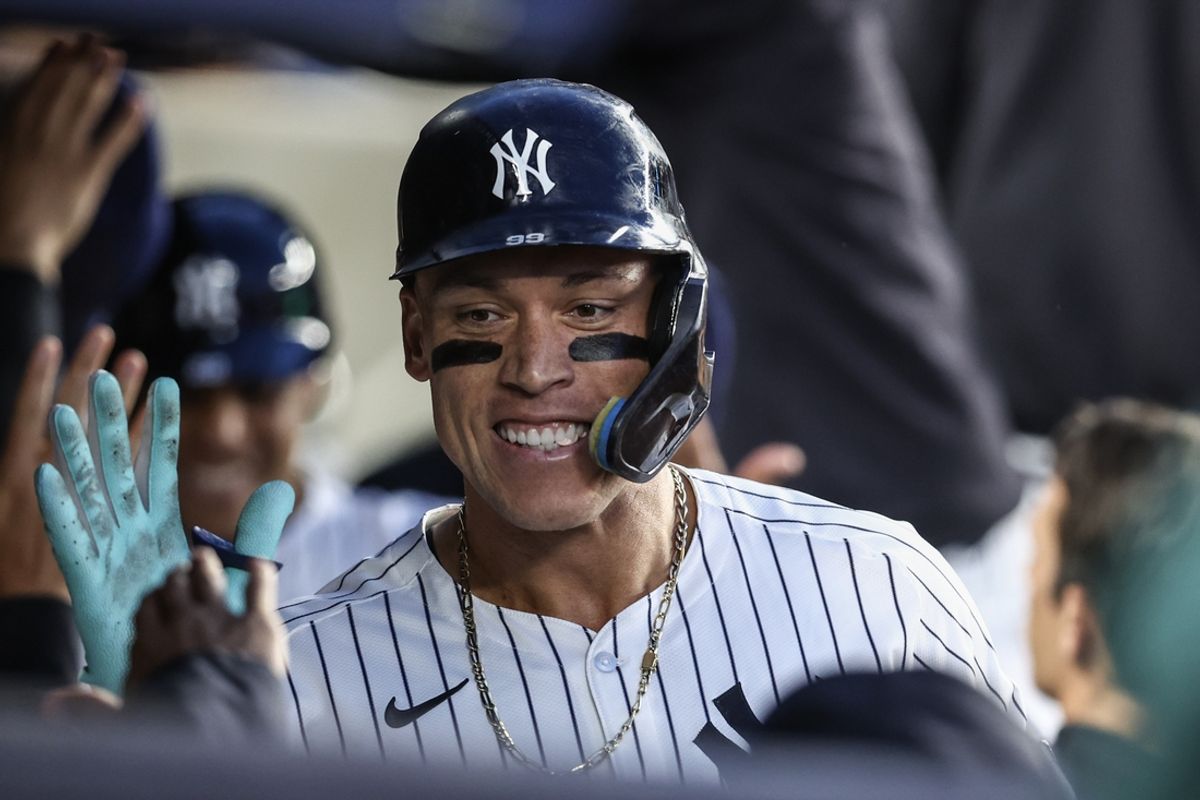 Aug 21, 2024; Bronx, New York, USA;  New York Yankees center fielder Aaron Judge (99) celebrates in the dugout after hitting a two run home run in the third inning against the Cleveland Guardians at Yankee Stadium. Mandatory Credit: Wendell Cruz-USA TODAY Sports
