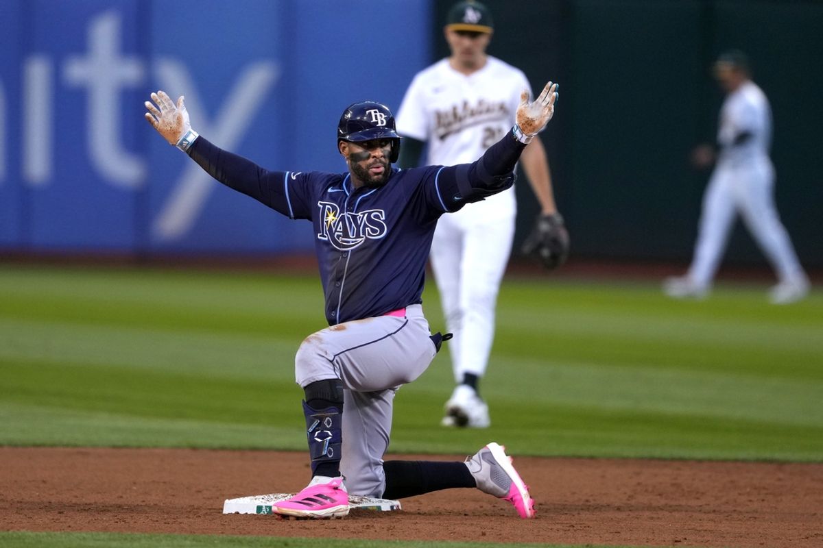 Aug 21, 2024; Oakland, California, USA; Tampa Bay Rays first baseman Yandy Diaz (2) gestures after hitting an RBI-double against the Oakland Athletics during the fifth inning at Oakland-Alameda County Coliseum. Mandatory Credit: Darren Yamashita-USA TODAY Sports