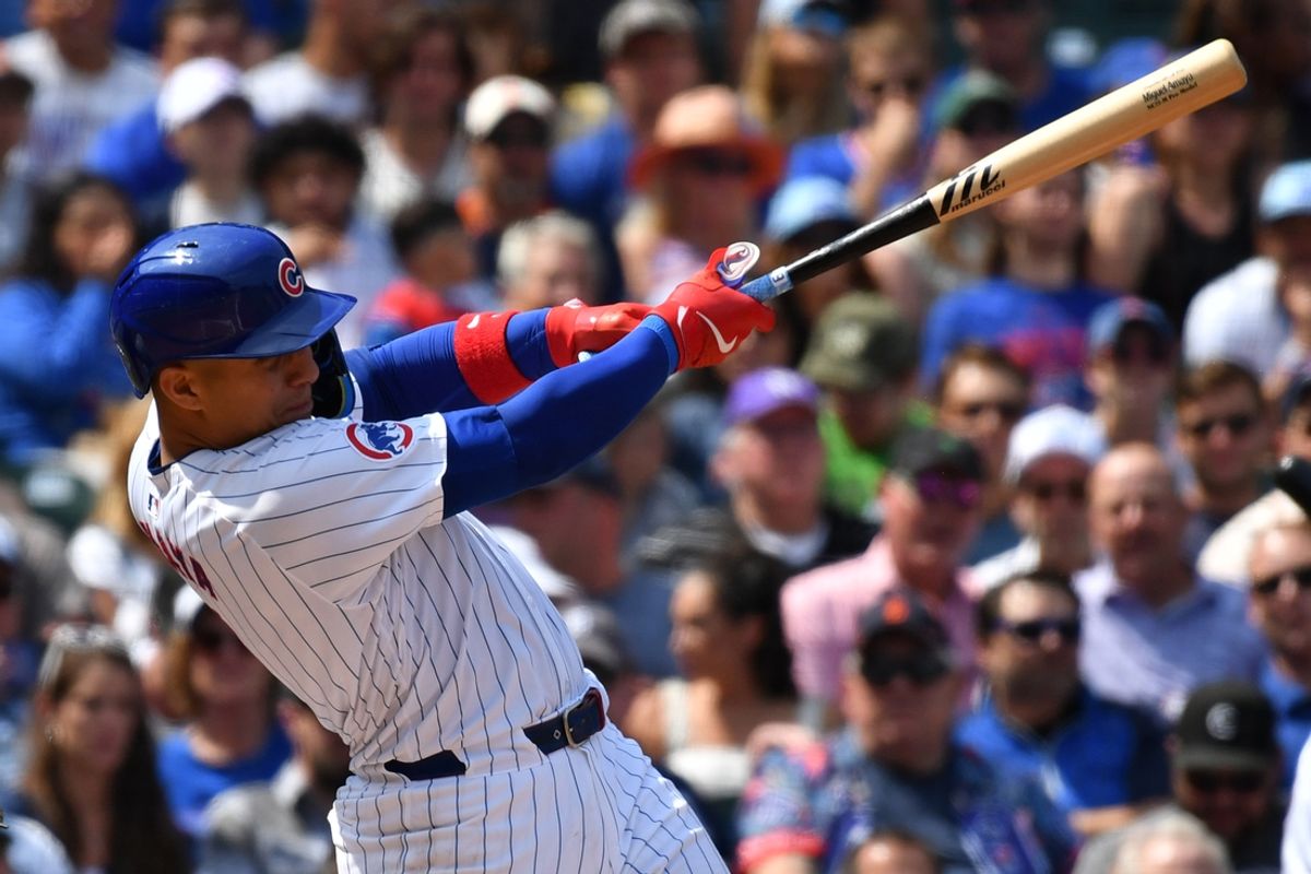 Aug 22, 2024; Chicago, Illinois, USA; Chicago Cubs catcher Miguel Amaya (9) hits a grand slam during the second inning against the Detroit Tigers at Wrigley Field. Mandatory Credit: Patrick Gorski-USA TODAY Sports