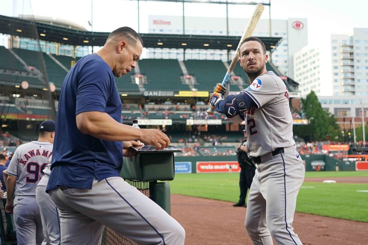 Aug 22, 2024; Baltimore, Maryland, USA; Houston Astros designated hitter Alex Bregman (right) works with hitting coach Alex Cintron (left) prior to the game against the Baltimore Orioles at Oriole Park at Camden Yards. Mandatory Credit: Mitch Stringer-Imagn Images