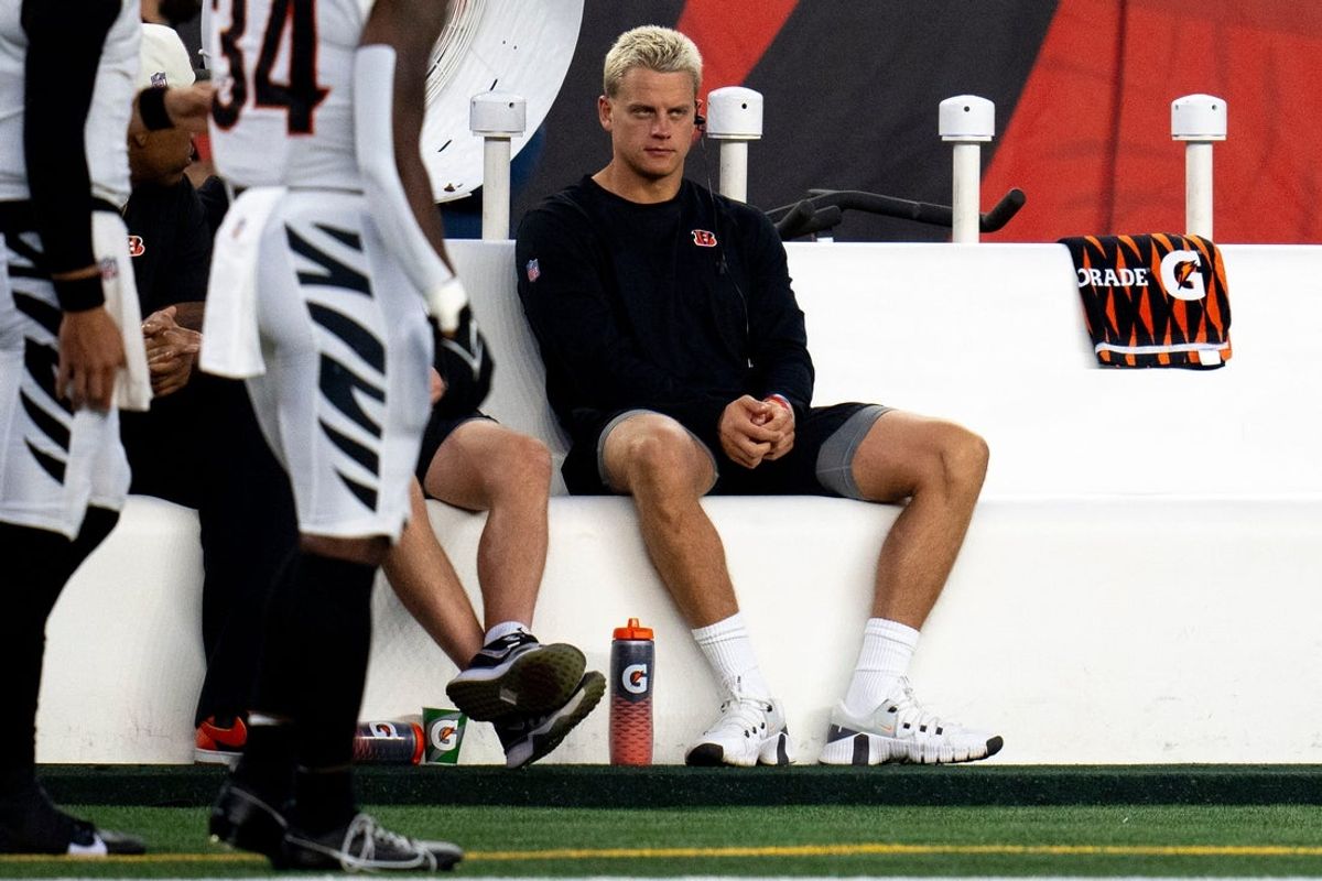 Cincinnati Bengals quarterback Joe Burrow (9) sits on the bench in the first quarter of the NFL preseason game between the Cincinnati Bengals and the Indianapolis Colts at Paycor Stadium in Cincinnati on Thursday, Aug. 22, 2024.