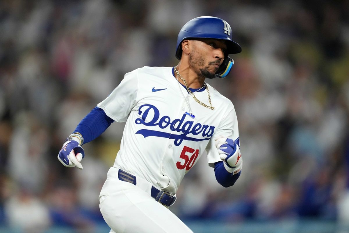 Aug 20, 2024; Los Angeles, California, USA; Los Angeles Dodgers right fielder Mookie Betts (50) runs the bases on a double in the eighth inning against the Seattle Mariners at Dodger Stadium. Mandatory Credit: Kirby Lee-USA TODAY Sports