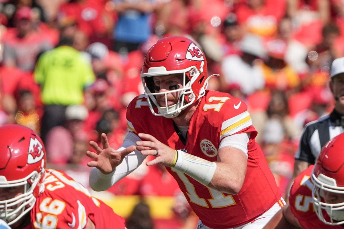 Aug 17, 2024; Kansas City, Missouri, USA; Kansas City Chiefs quarterback Carson Wentz (11) readies for the snap against the Detroit Lions during the game at GEHA Field at Arrowhead Stadium. Mandatory Credit: Denny Medley-Imagn Images