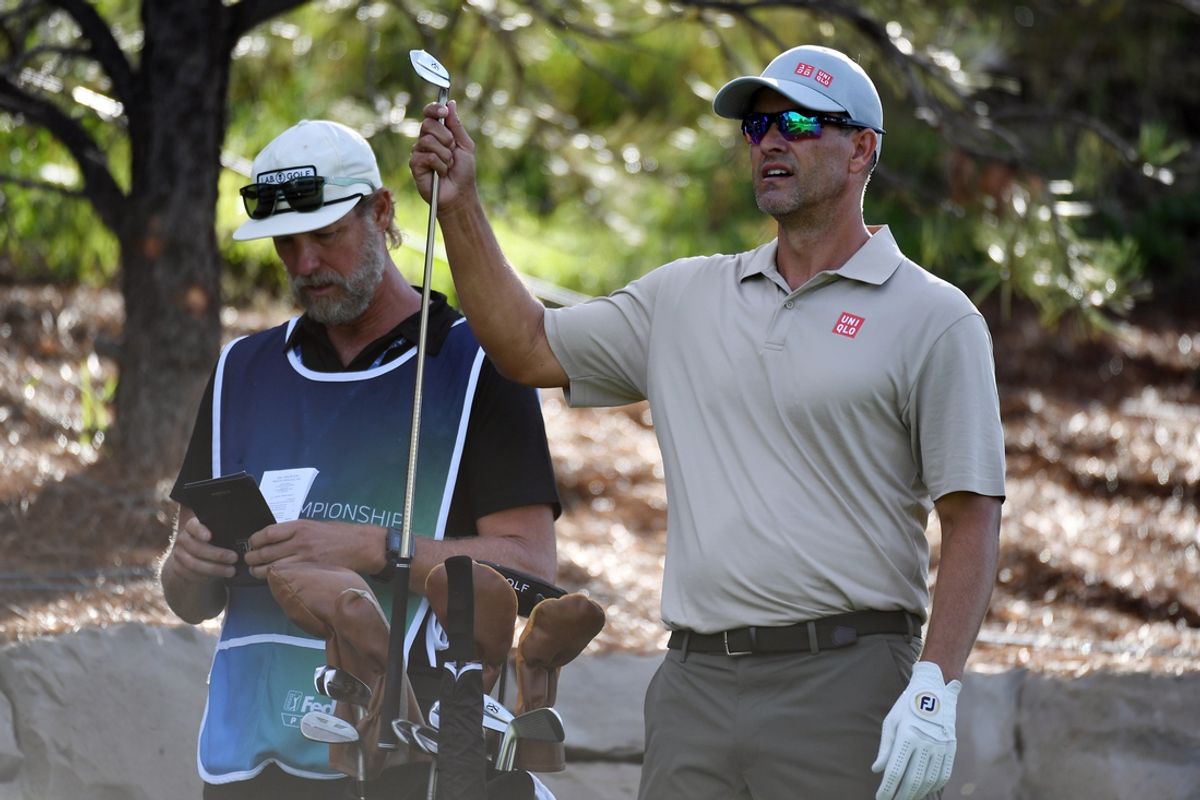 Aug 23, 2024; Castle Rock, Colorado, USA; Adam Scott grabs a club before his shot on the seventh hole during the second round of the BMW Championship golf tournament at Castle Pines Golf Club. Mandatory Credit: Christopher Hanewinckel-USA TODAY Sports