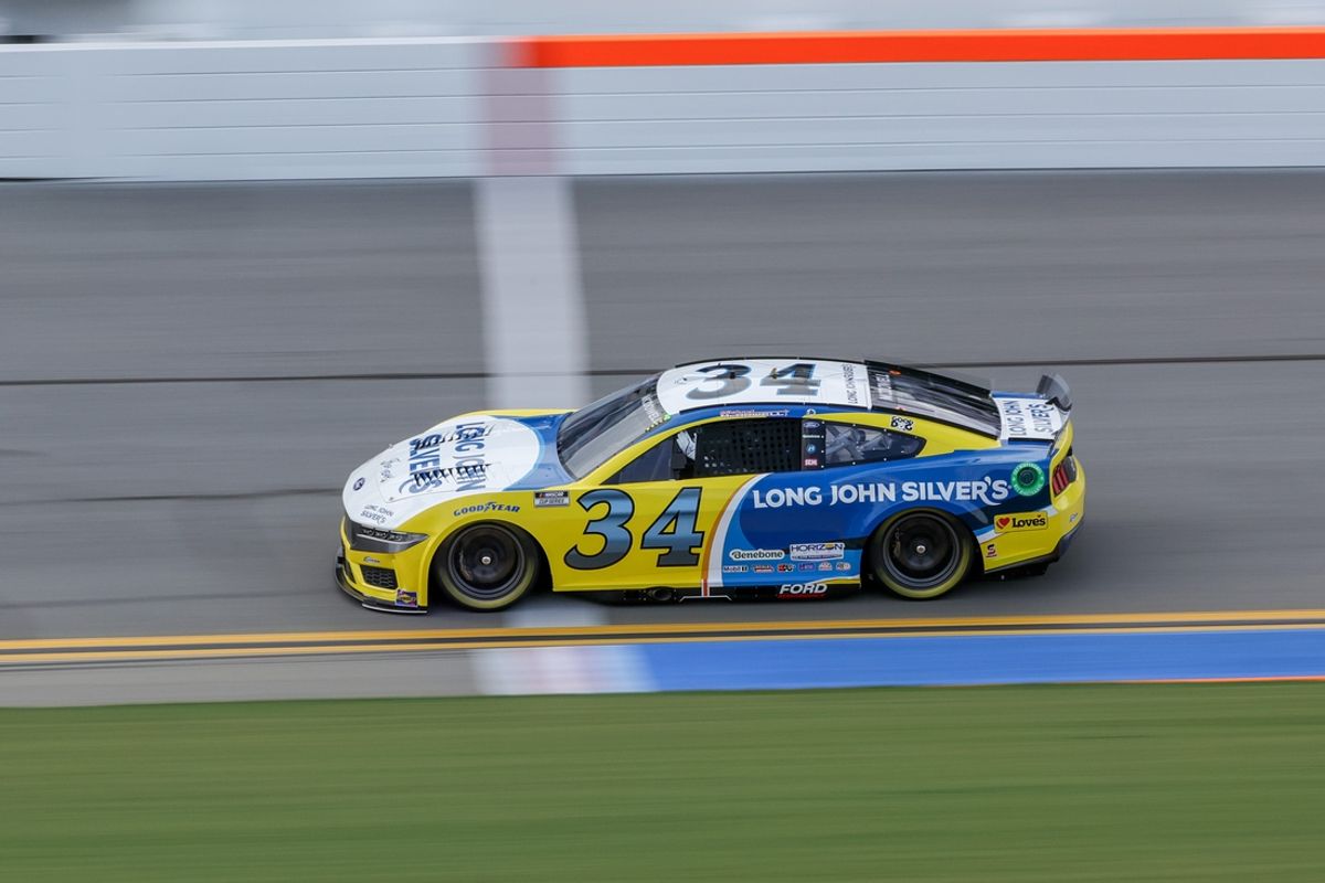 Aug 23, 2024; Daytona Beach, Florida, USA; NASCAR Cup Series driver Michael McDowell (34) wins poll position for the Coke Zero Sugar 400 at Daytona International Speedway. Mandatory Credit: Mike Watters-Imagn Images