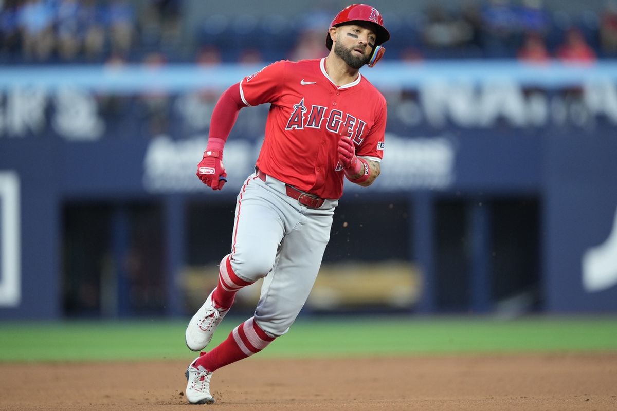 Aug 23, 2024; Toronto, Ontario, CAN; Los Angeles Angels center fielder Kevin Pillar (12) scores from first base against the Toronto Blue Jays on a double by Los Angeles Angels third baseman Anthony Rendon (not pictured) during the second inning at Rogers Centre. Mandatory Credit: John E. Sokolowski-Imagn Images