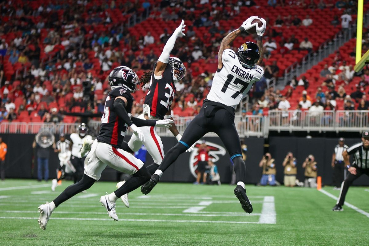Aug 23, 2024; Atlanta, Georgia, USA; Jacksonville Jaguars tight end Evan Engram (17) catches a touchdown pass over Atlanta Falcons cornerback Jayden Price (36) and cornerback Kevin King (32) in the first quarter at Mercedes-Benz Stadium. Mandatory Credit: Brett Davis-Imagn Images