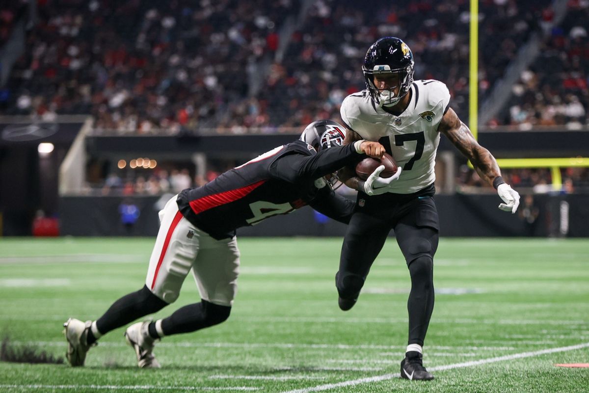 Aug 23, 2024; Atlanta, Georgia, USA; Jacksonville Jaguars tight end Evan Engram (17) is pushed out of bounds by Atlanta Falcons linebacker Bradlee Anae (47) in the second quarter at Mercedes-Benz Stadium. Mandatory Credit: Brett Davis-Imagn Images