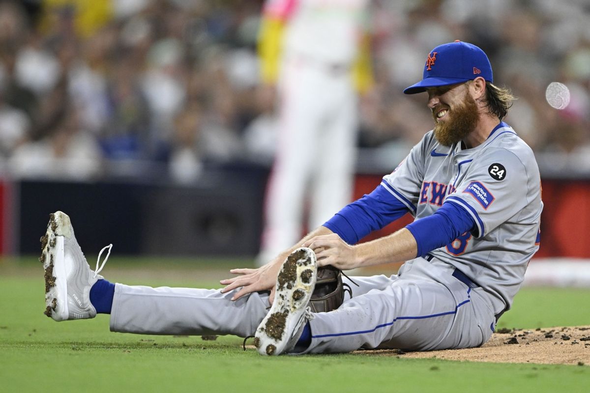 Aug 23, 2024; San Diego, California, USA; New York Mets starting pitcher Paul Blackburn (58) reacts after being hit during the third inning against the San Diego Padres at Petco Park. Mandatory Credit: Denis Poroy-Imagn Images