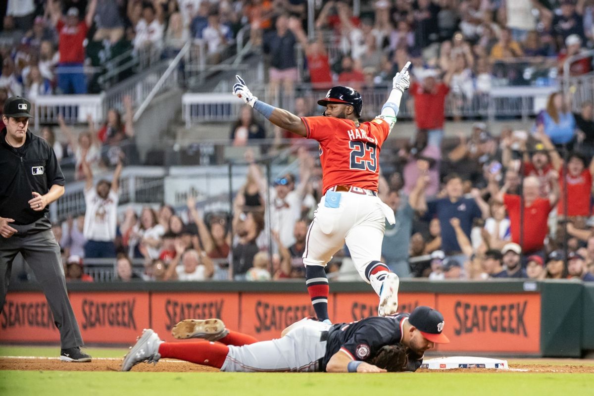 Aug 23, 2024; Cumberland, Georgia, USA; Atlanta Braves outfielder Michael Harris II (23) runs through first base for an RBI to win the game against the Washington Nationals during the tenth inning at Truist Park. Mandatory Credit: Jordan Godfree-USA TODAY Sports