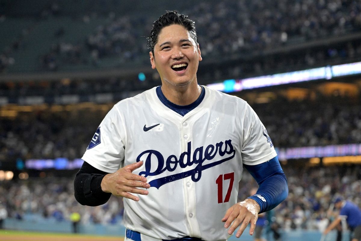 Aug 23, 2024; Los Angeles, California, USA;  Los Angeles Dodgers designated hitter Shohei Ohtani (17) after he was doused with ice water after hitting a walk-off grand slam home run, his 40th of the season, in the ninth inning against the Tampa Bay Rays at Dodger Stadium. Watson. Mandatory Credit: Jayne Kamin-Oncea-USA TODAY Sports