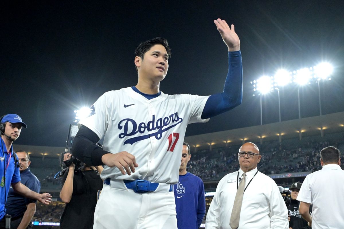 Aug 23, 2024; Los Angeles, California, USA;  Los Angeles Dodgers designated hitter Shohei Ohtani (17) smiles to fans as he leaves the field after hitting a walk-off grand slam home run, his 40th of the season, in the ninth inning against the Tampa Bay Rays at Dodger Stadium. Watson. Mandatory Credit: Jayne Kamin-Oncea-Imagn Images