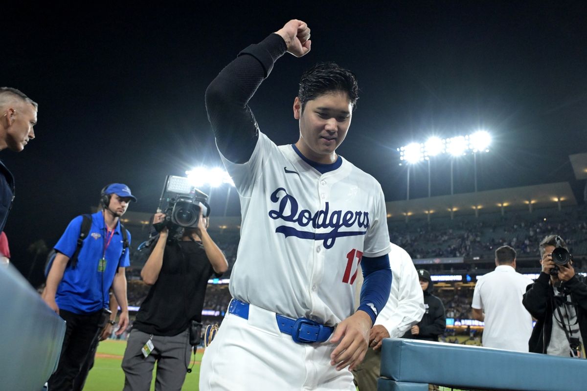 Aug 23, 2024; Los Angeles, California, USA;  Los Angeles Dodgers designated hitter Shohei Ohtani (17) smiles to fans as he leaves the field after hitting a walk-off grand slam home run, his 40th of the season, in the ninth inning against the Tampa Bay Rays at Dodger Stadium. Watson. Mandatory Credit: Jayne Kamin-Oncea-USA TODAY Sports