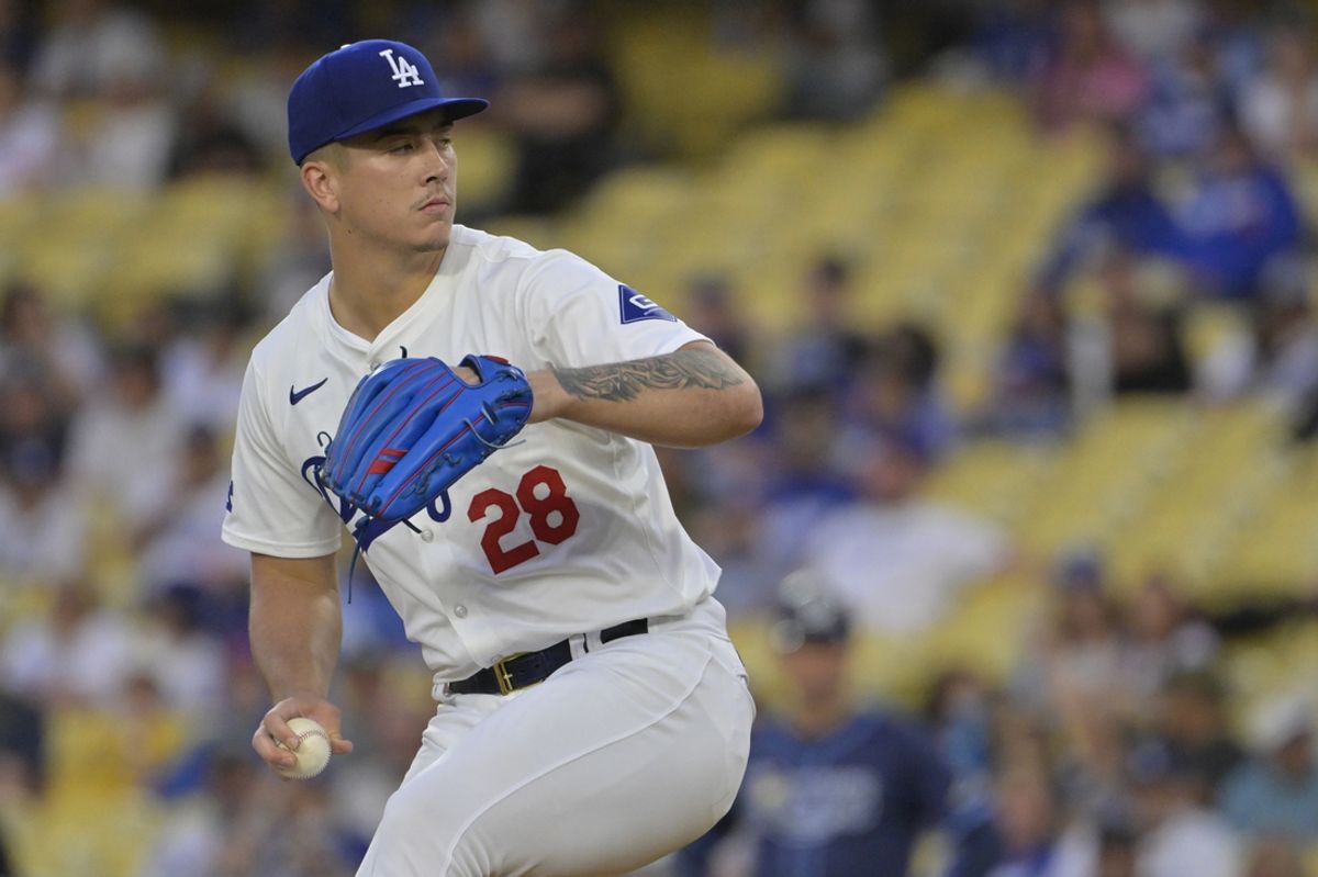 Aug 23, 2024; Los Angeles, California, USA;  Los Angeles Dodgers starting pitcher Bobby Miller (28) delivers to the plate in the first inning against the Tampa Bay Rays at Dodger Stadium. Mandatory Credit: Jayne Kamin-Oncea-USA TODAY Sports