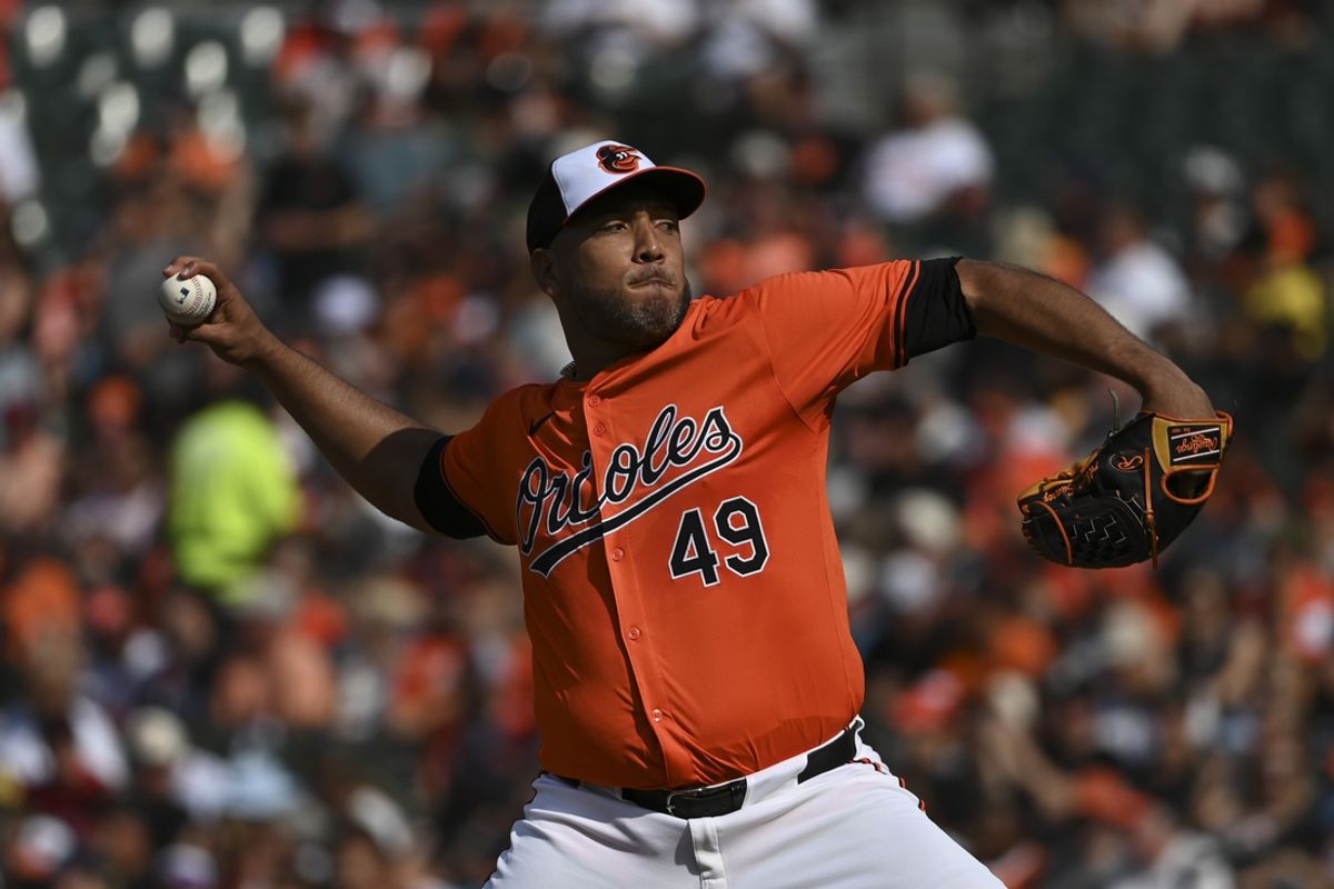 Aug 24, 2024; Baltimore, Maryland, USA;  Baltimore Orioles starting pitcher Albert Suarez (49) throws a first inning pitch against the Houston Astros at Oriole Park at Camden Yards. Mandatory Credit: Tommy Gilligan-USA TODAY Sports
