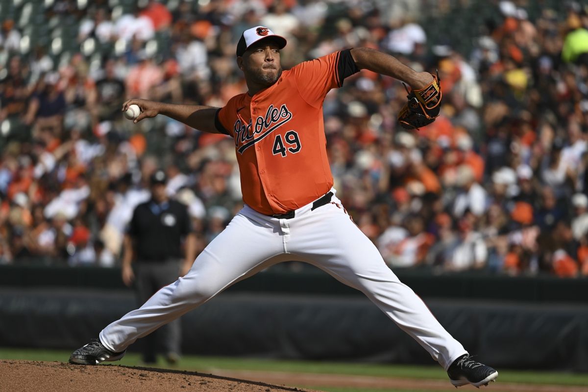 Aug 24, 2024; Baltimore, Maryland, USA; Baltimore Orioles starting pitcher Albert Suarez (49) delivers a second inning pitch against the Houston Astros  at Oriole Park at Camden Yards. Mandatory Credit: Tommy Gilligan-Imagn Images