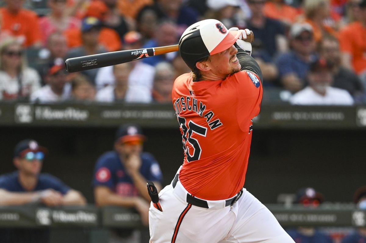 Aug 24, 2024; Baltimore, Maryland, USA; Baltimore Orioles catcher Adley Rutschman (35) doubles during the third inning against the Houston Astros  at Oriole Park at Camden Yards. Mandatory Credit: Tommy Gilligan-USA TODAY Sports