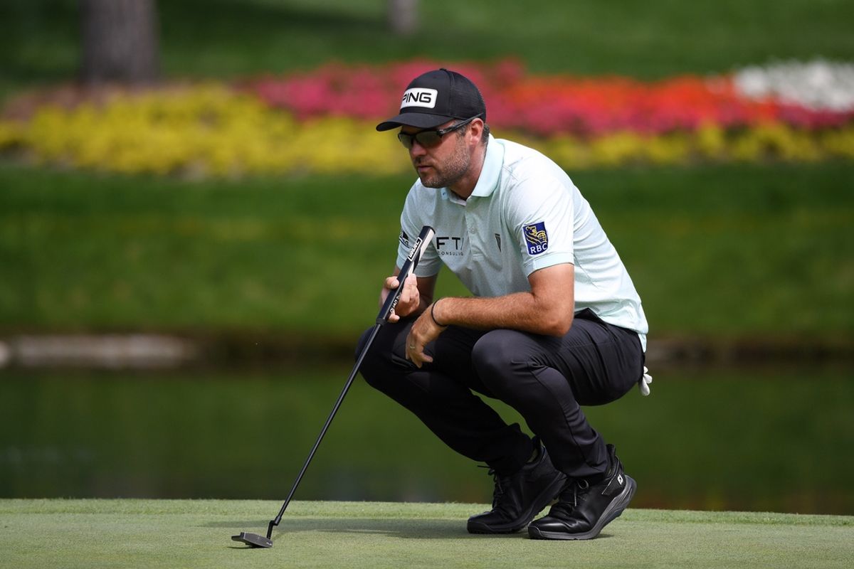 Aug 24, 2024; Castle Rock, Colorado, USA; Corey Conners lines up a putt on the 14th hole during the third round of the BMW Championship golf tournament at Castle Pines Golf Club. Mandatory Credit: Christopher Hanewinckel-Imagn Images