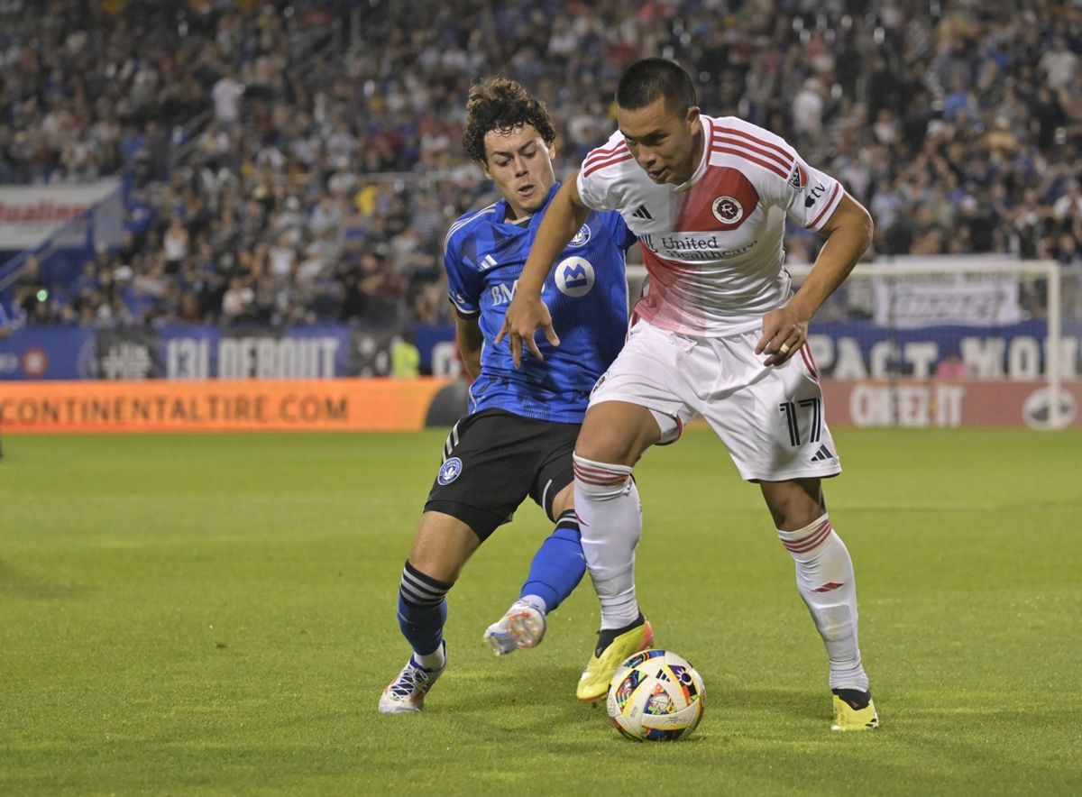 Aug 24, 2024; Montreal, Quebec, CAN; New England Revolution forward Bobby Wood (17) battles CF Montreal midfielder Caden Clark (23) for control of a ball during the second half at Stade Saputo. Mandatory Credit: Eric Bolte-Imagn Images