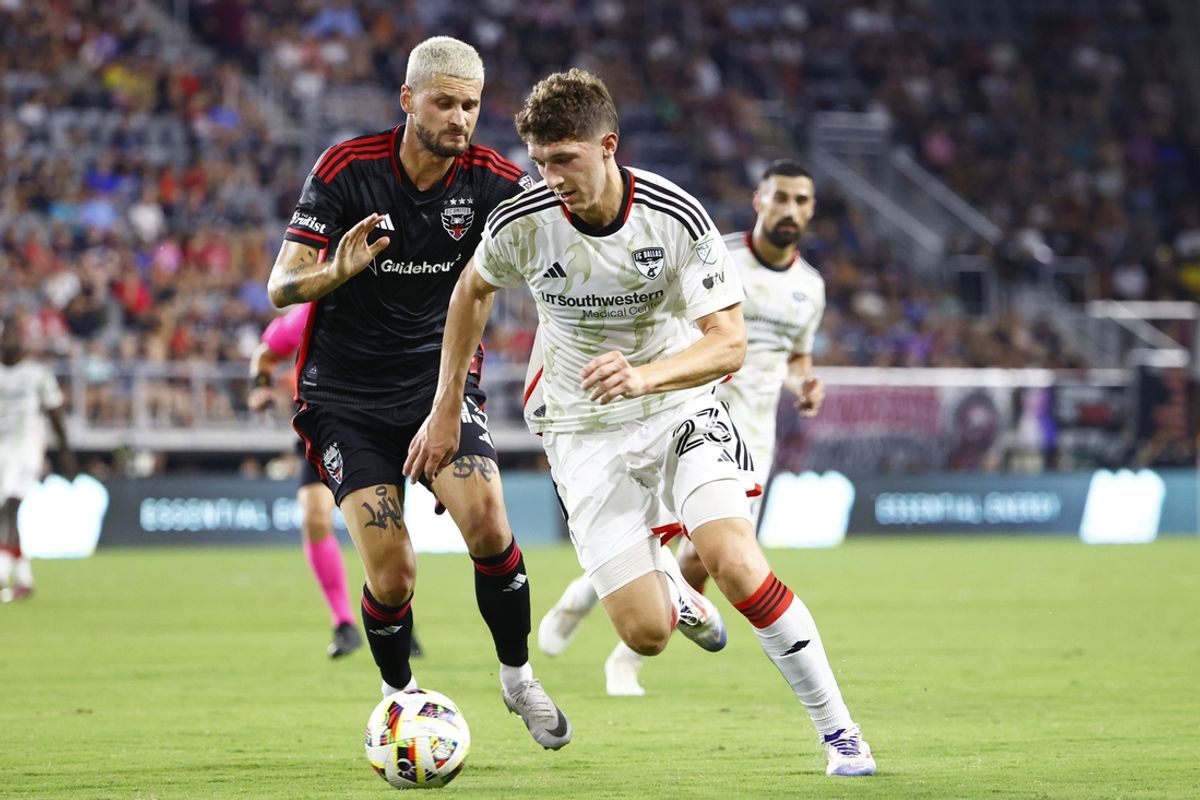 Aug 24, 2024; Washington, District of Columbia, USA; D.C. United midfielder Mateusz Klich (43) and FC Dallas forward Logan Farrington (23) battle for the ball in the first half at Audi Field. Mandatory Credit: Amber Searls-USA TODAY Sports